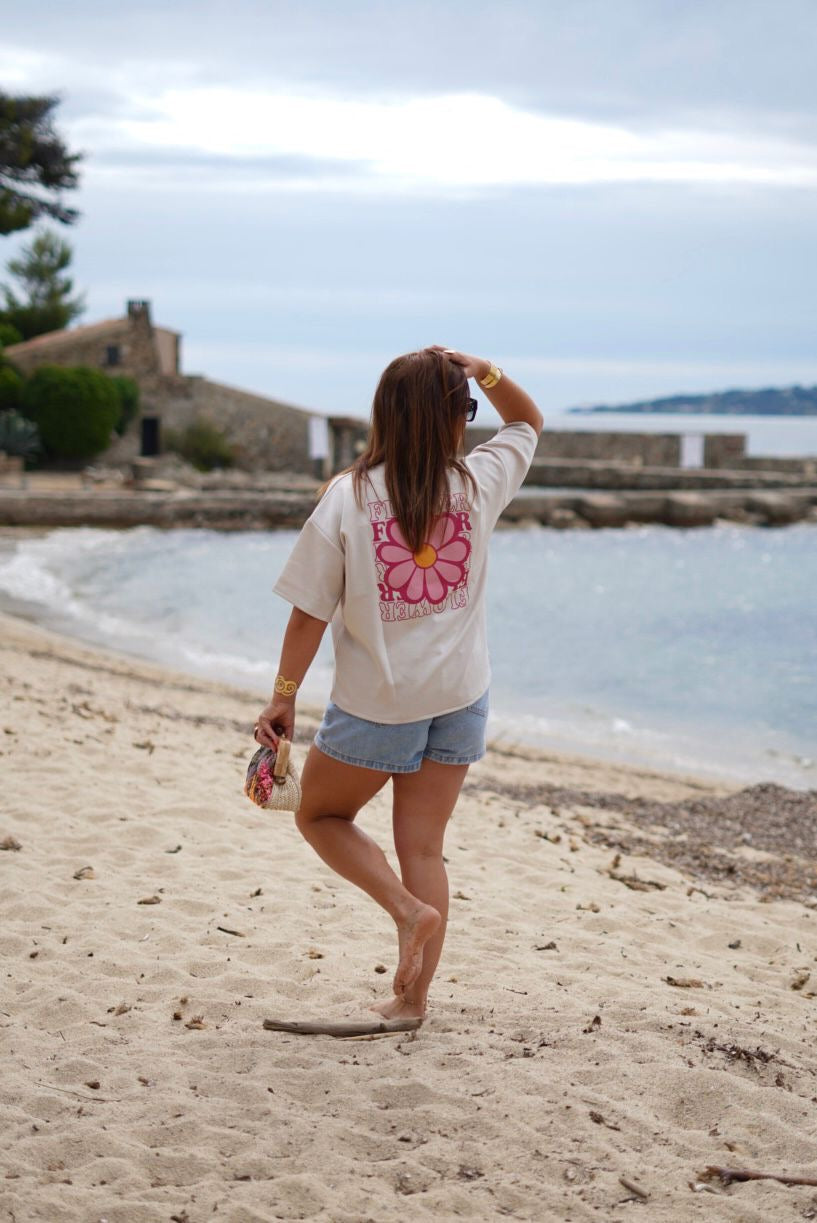 T-shirt beige avec un  imprimé Fleur sur le dos
