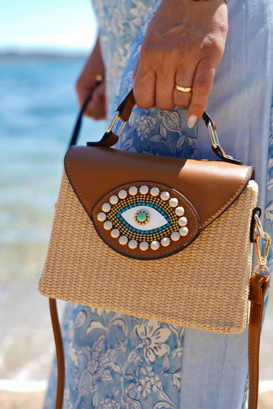 Sac bohème en raphia et similicuir avec œil protecteur